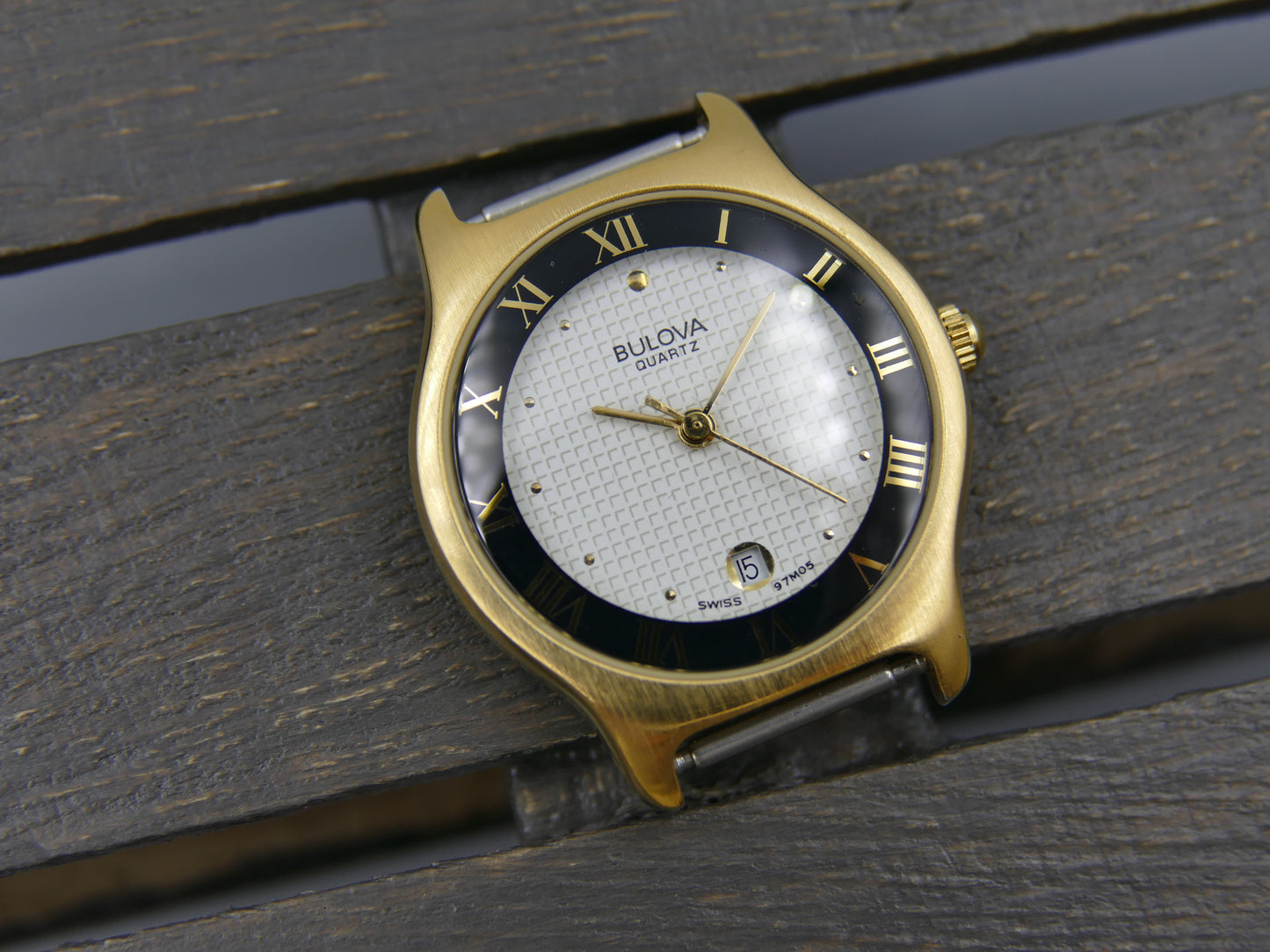 Bulova 97MO5 Roman Numeral Black Bezel Gold Tone SS Ladies Watch