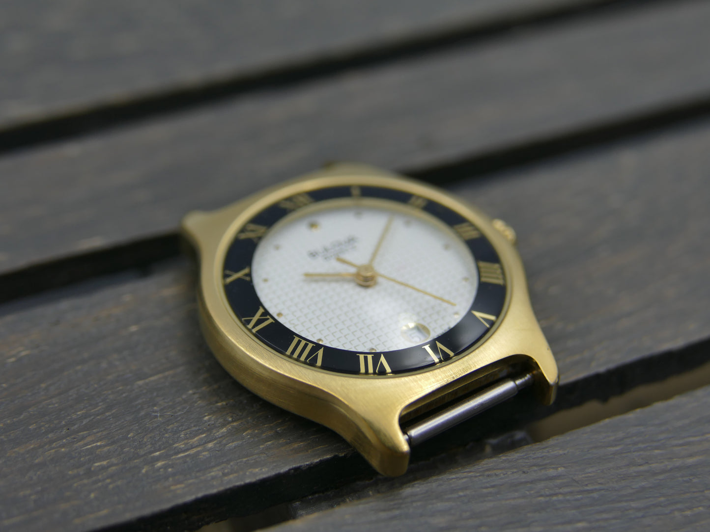 Bulova 97MO5 Roman Numeral Black Bezel Gold Tone SS Ladies Watch