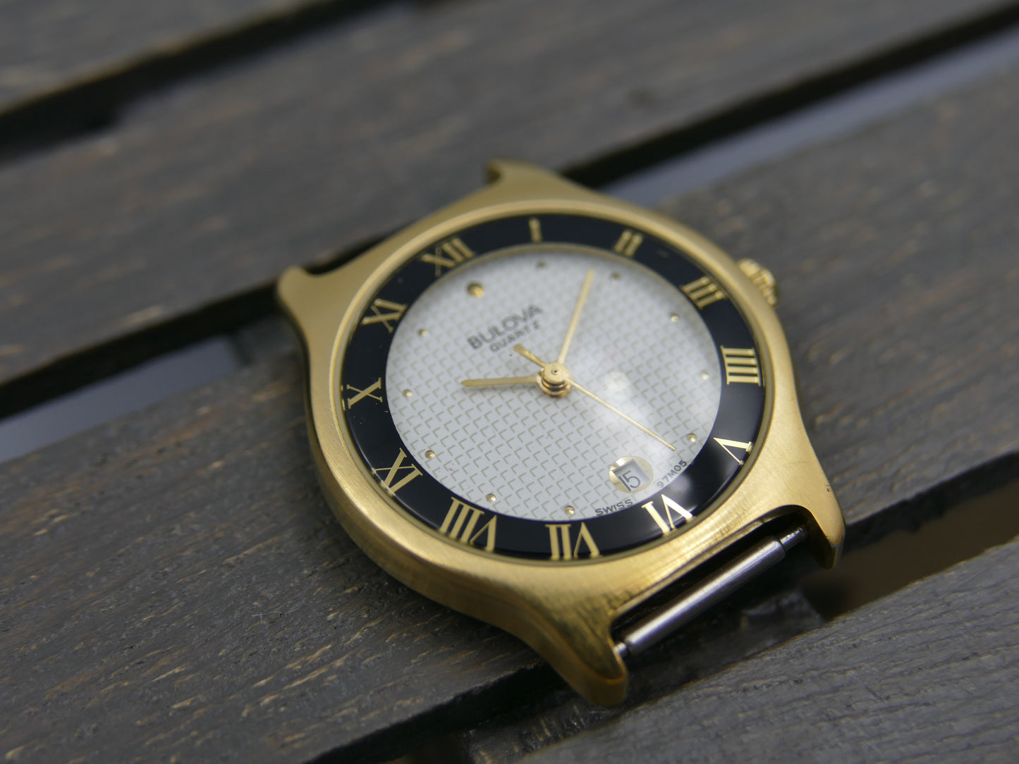 Bulova 97MO5 Roman Numeral Black Bezel Gold Tone SS Ladies Watch