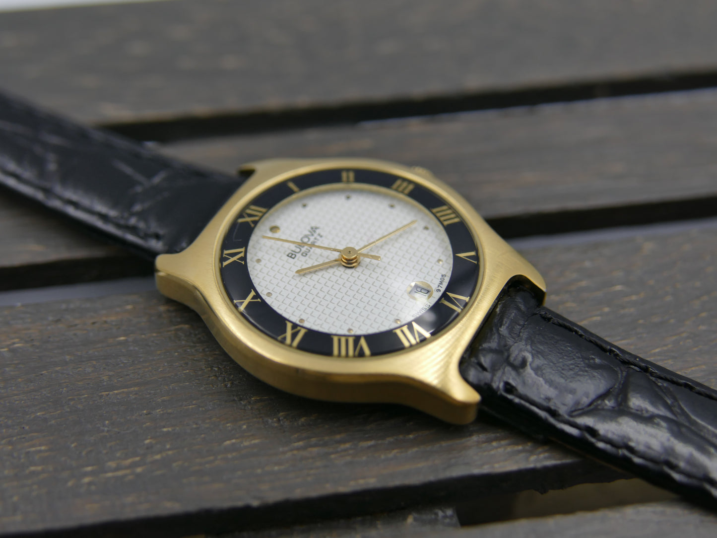 Bulova 97MO5 Roman Numeral Black Bezel Gold Tone SS Ladies Watch