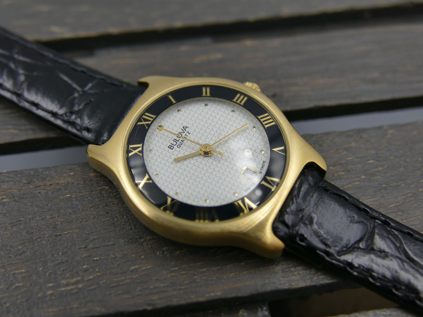Bulova 97MO5 Roman Numeral Black Bezel Gold Tone SS Ladies Watch