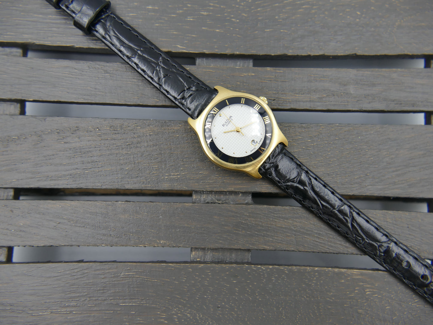 Bulova 97MO5 Roman Numeral Black Bezel Gold Tone SS Ladies Watch