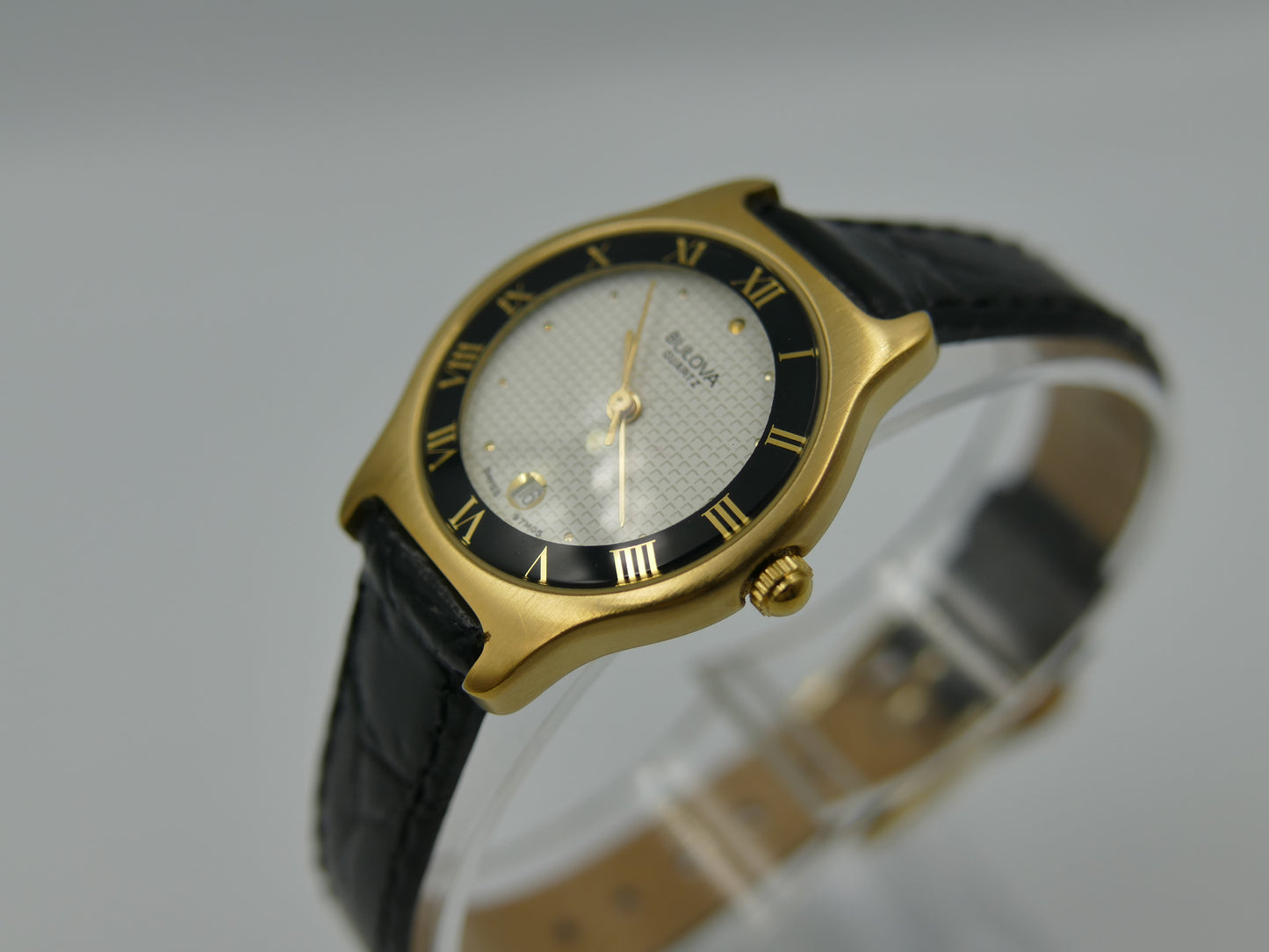 Bulova 97MO5 Roman Numeral Black Bezel Gold Tone SS Ladies Watch