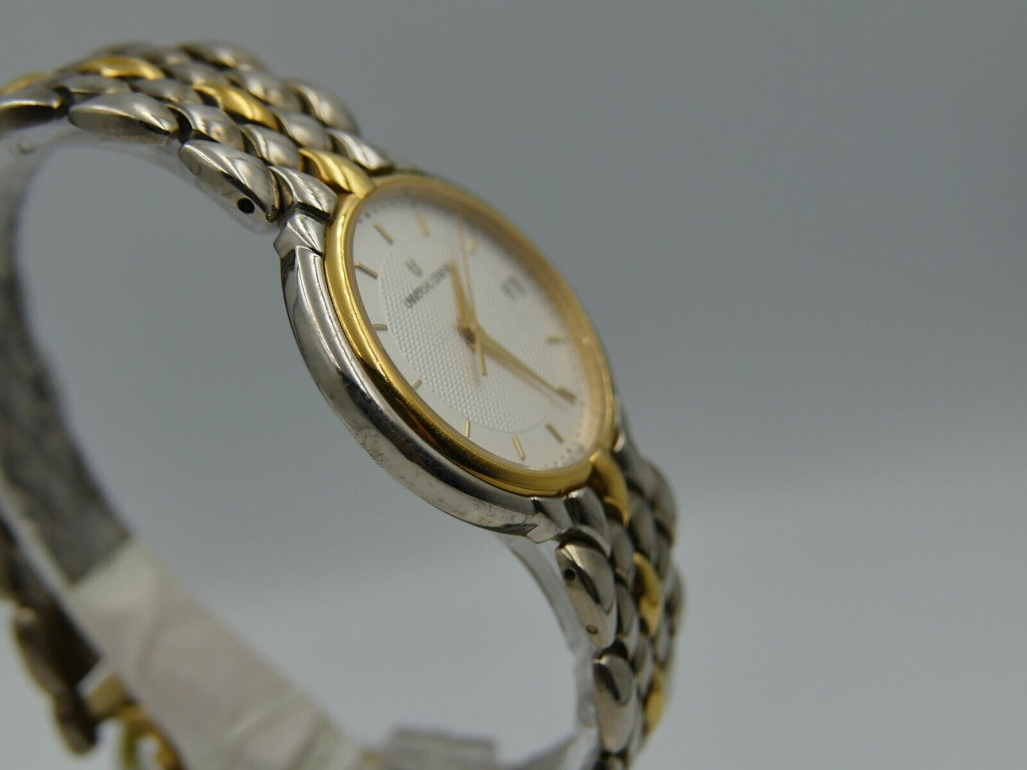 80's vintage watch mens universal geneve ref. 650.100 steel gold flat rare mint