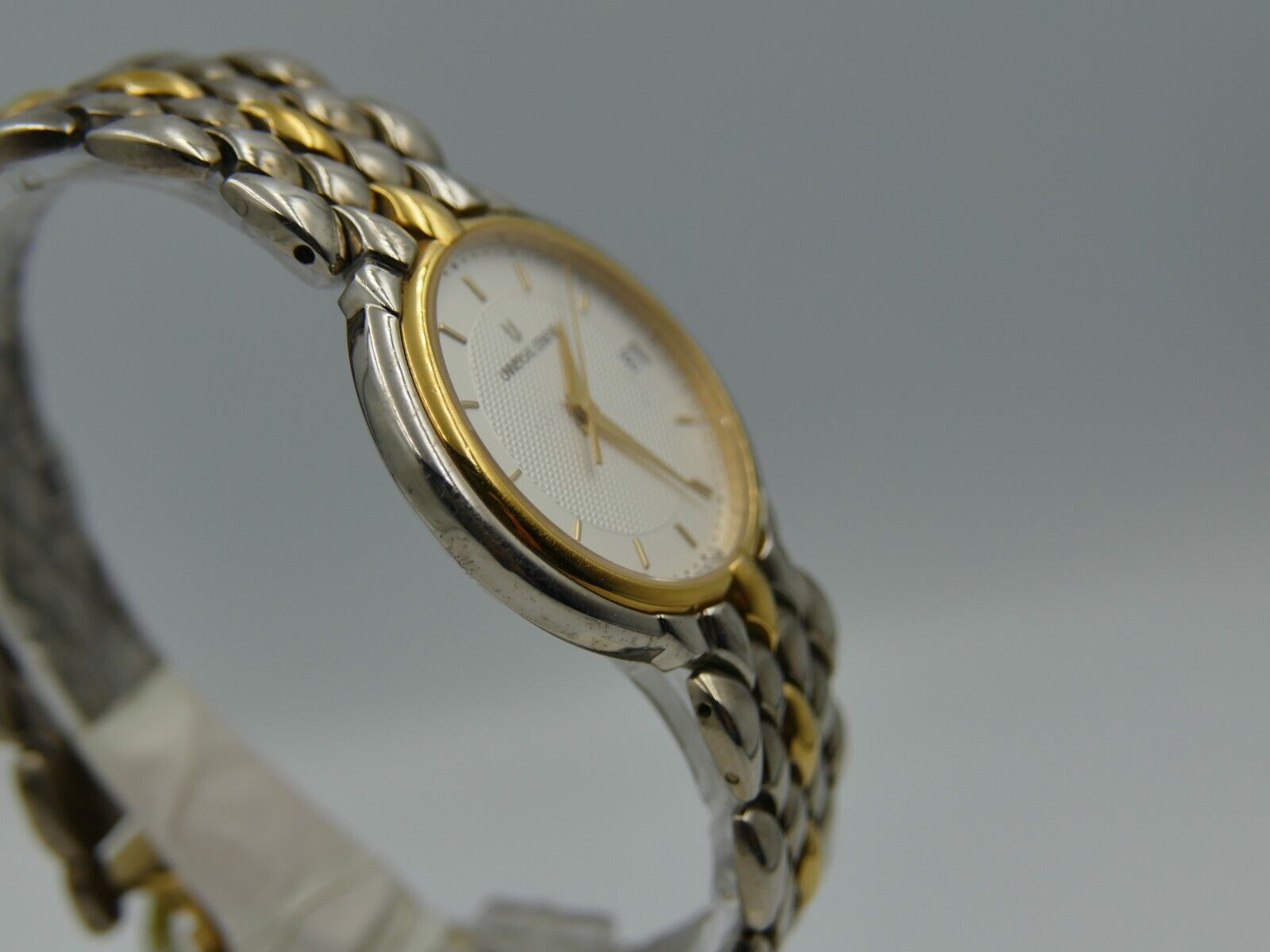 80's vintage watch mens universal geneve ref. 650.100 steel gold flat rare mint