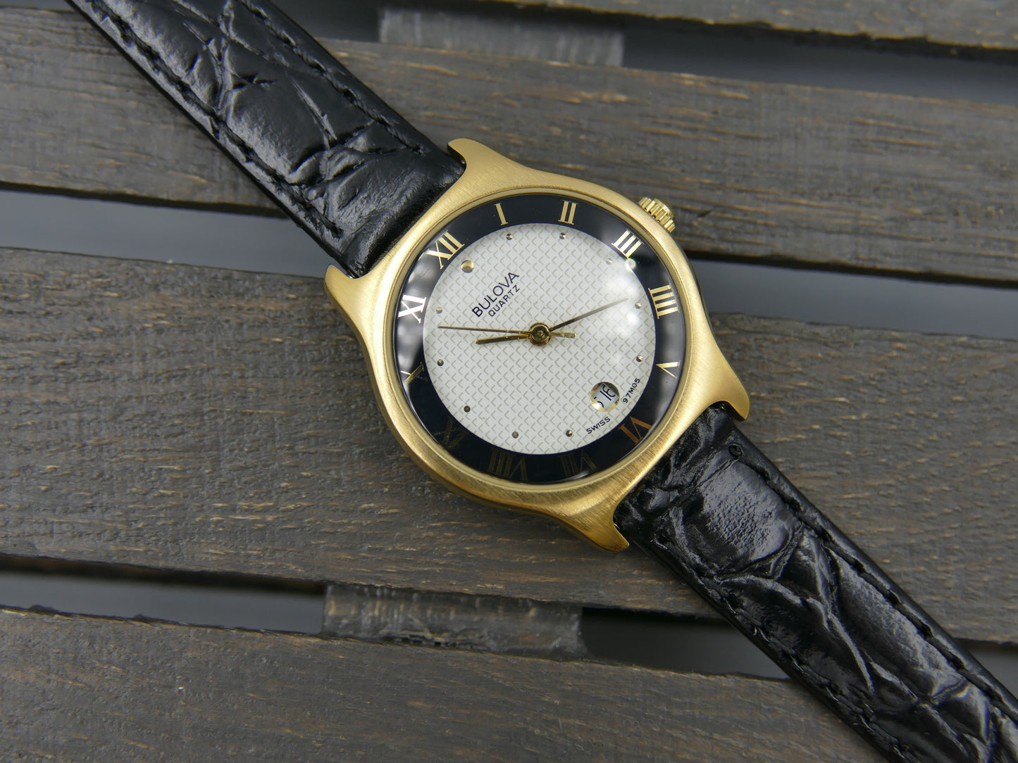 Bulova 97MO5 Roman Numeral Black Bezel Gold Tone SS Ladies Watch