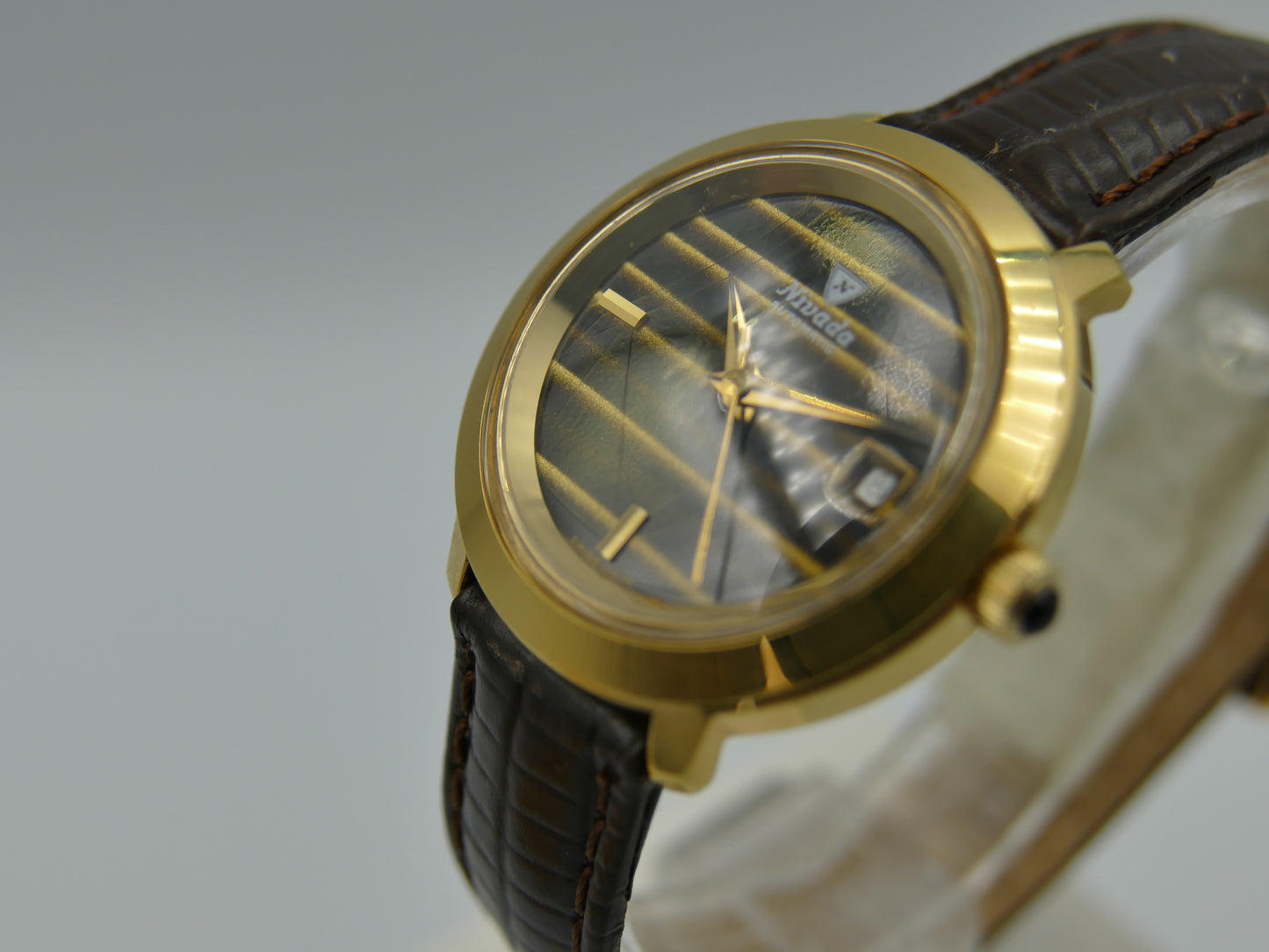 Vintage watch Nivada tiger eye dial Yves Saint Laurent ref 5490 automatic AS 1788
